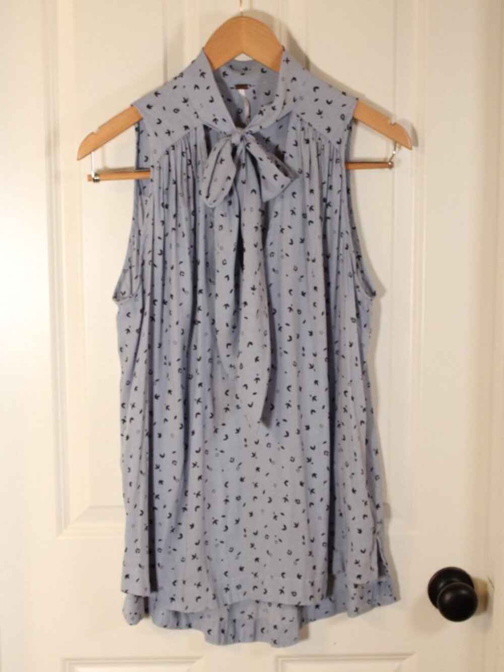 Free People sleeveless blouse bow size large